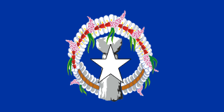 The flag of the Northern Mariana Islands is blue with a five-pointed white star on a gray latte stone (a traditional foundation stone) in the center, surrounded by a head lei (wreath).