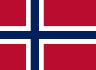 The flag of Svalbard and Jan Mayen has a red field with a large white-edged navy blue cross that extends to the edges of the field. The vertical part of this cross is offset towards the hoist side.