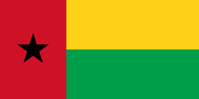 The flag of Guinea-Bissau features a red vertical band on its hoist side that takes up about two-fifth the width of the field, and two equal horizontal bands of yellow and green adjoining the vertical band. A five-pointed black star is centered in the vertical band.