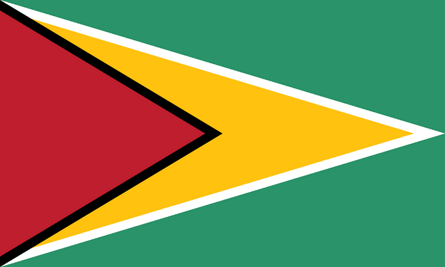 The flag of Guyana has a green field with two isosceles triangles which share a common base on the hoist end. The smaller black-edged red triangle spanning half the width of the field is superimposed on the larger white-edged yellow triangle which spans the full width of the field.