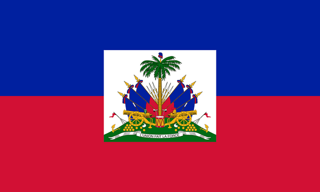The flag of Haiti is composed of two equal horizontal bands of blue and red. A white square bearing the national coat of arms is superimposed at the center of the field.