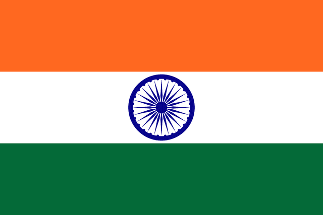 The flag of India is composed of three equal horizontal bands of saffron, white and green. A navy blue wheel with twenty-four spokes — the Ashoka Chakra — is centered in the white band.