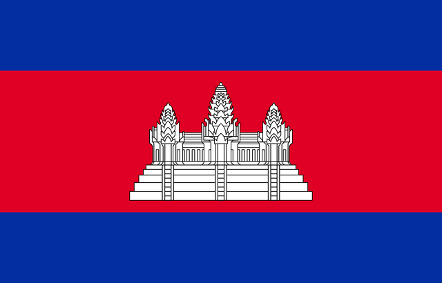 The flag of Cambodia features three horizontal bands of blue, red and blue, with a white depiction of the temple complex, Angkor Wat centered in the red band.
