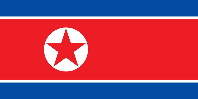 The flag of North Korea is composed of three horizontal bands — a large central white-edged red band, and a blue band above and beneath the red band. On the hoist side of the red band is a red five-pointed star within a white circle.
