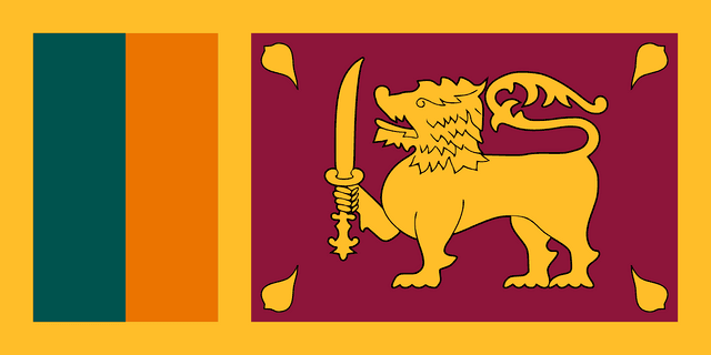 The flag of Sri Lanka features two large adjacent but separate rectangular areas, centered on a golden-yellow field. The smaller hoist-side rectangle is divided into two equal vertical bands of teal and orange, and the larger fly-side rectangle is maroon with a centered golden-yellow lion holding a Kastane sword in its right fore-paw and four golden-yellow Bo leaves, one in each corner.