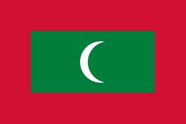 The flag of Maldives has a red field, at the center of which is a large green rectangle bearing a fly-side facing white crescent.