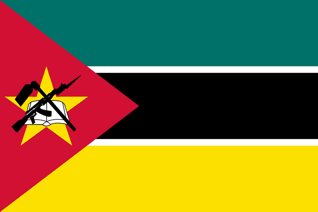 The flag of Mozambique is composed of three equal horizontal bands of teal, black with white top and bottom edges, and yellow. A red isosceles triangle spanning about two-fifth the width of the field is superimposed on the hoist side with its base on the hoist end. This triangle bears a crossed rifle and hoe in black superimposed on an open white book which is superimposed on a five-pointed yellow star.