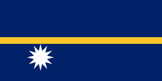 The flag of Nauru has a dark blue field with a thin yellow horizontal band across the center and a large white twelve-pointed star beneath the horizontal band on the hoist side of the field.